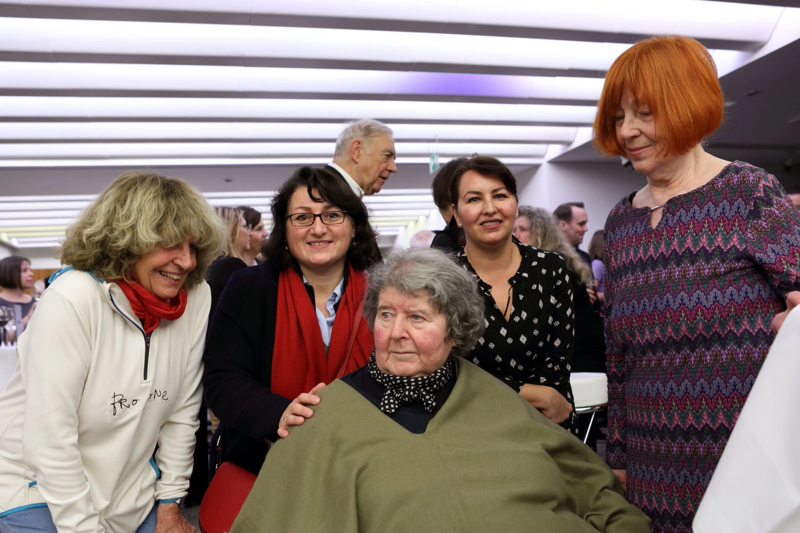 The picture shows visitors to the press conference at the exhibition opening.